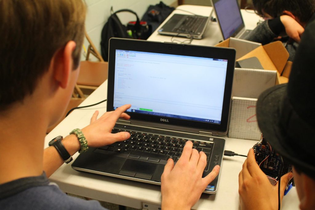 This computer class for teens teaches coding in c. They work in teams programming microcontrollers.