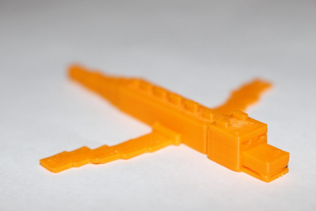 3D Printed Ender Dragon designed by student in CAD and 3D Printed with orange filament