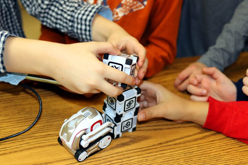 Kids have fun with Cozmo education using teamwork, problem solving, and critical thinking in our STEM Camps for Kids