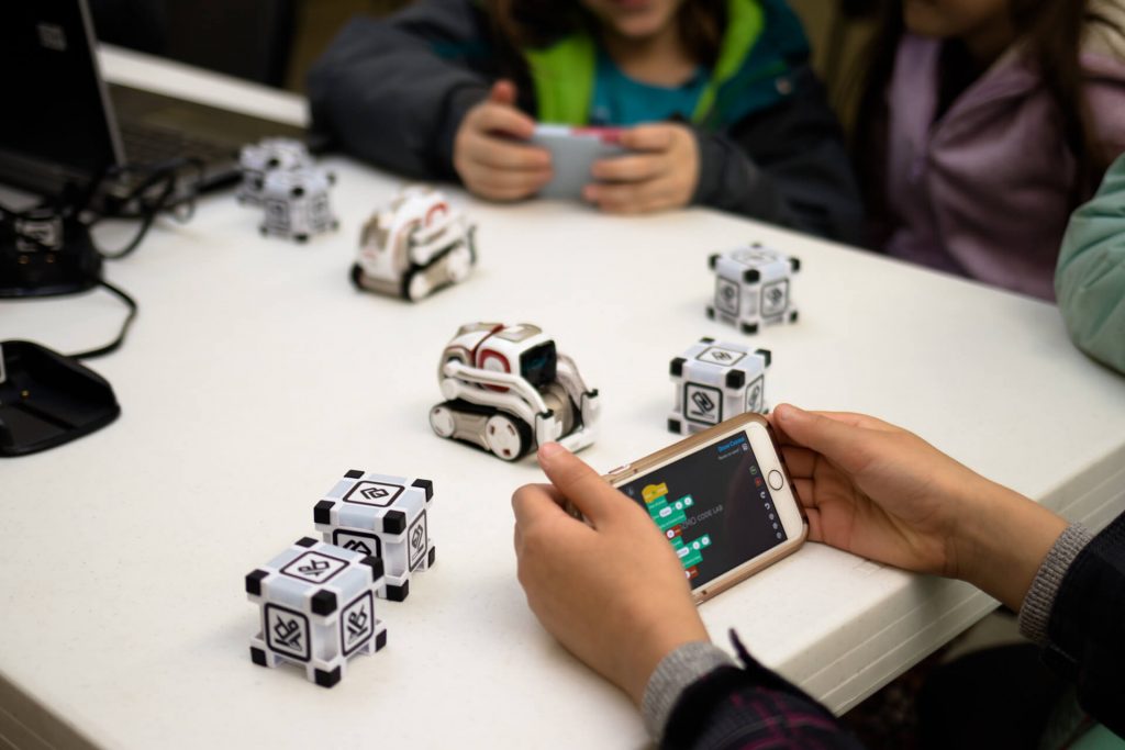 girls block coding Cozmo with Code Lab in Kinvert Robotics for Kids class